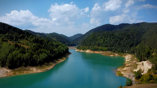 Peaceful bay of Zaovine Lake on Tara surrounded by mountains